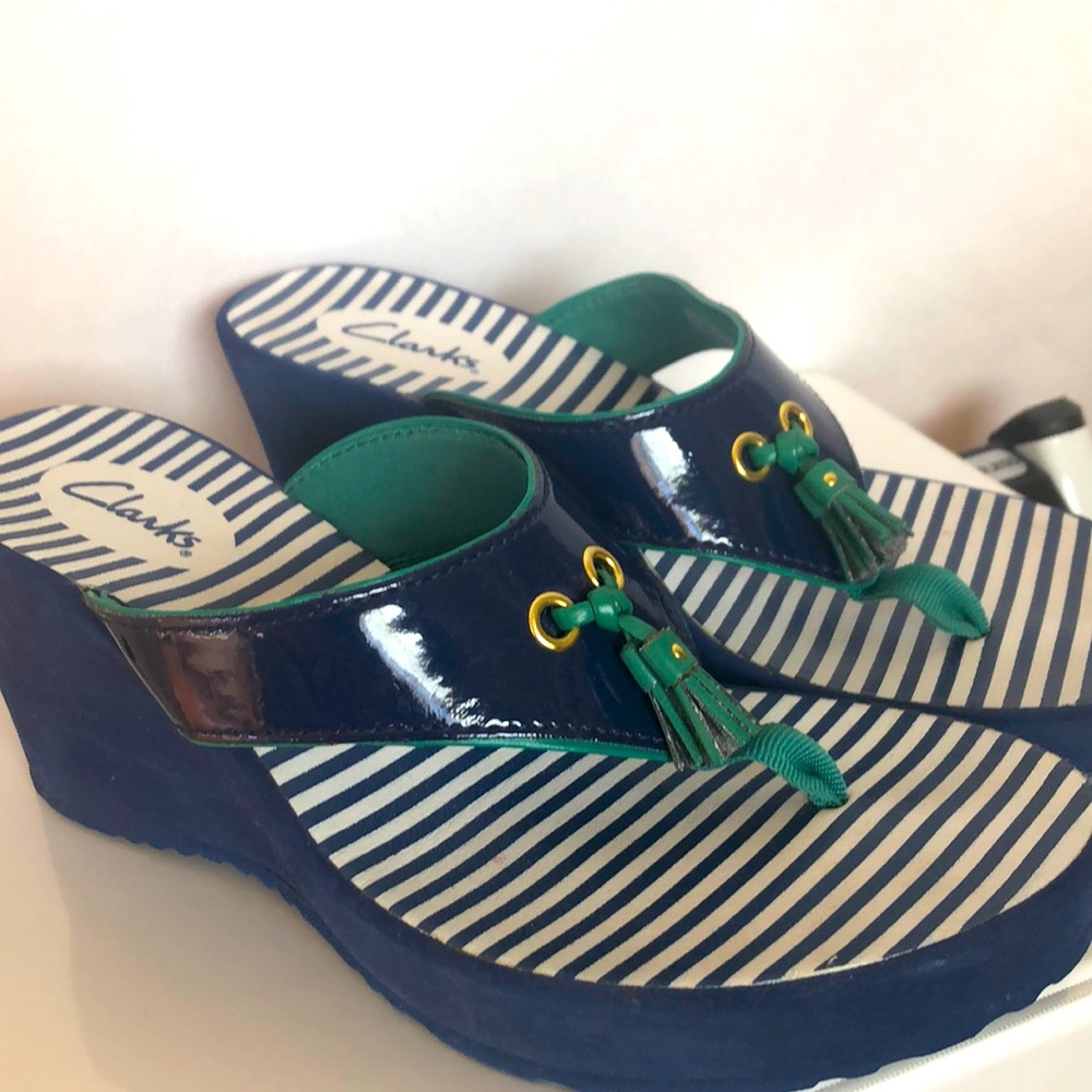 Clarks wedge flip flops. Never worn. Navy blue with green trim and tassel. Sz 6